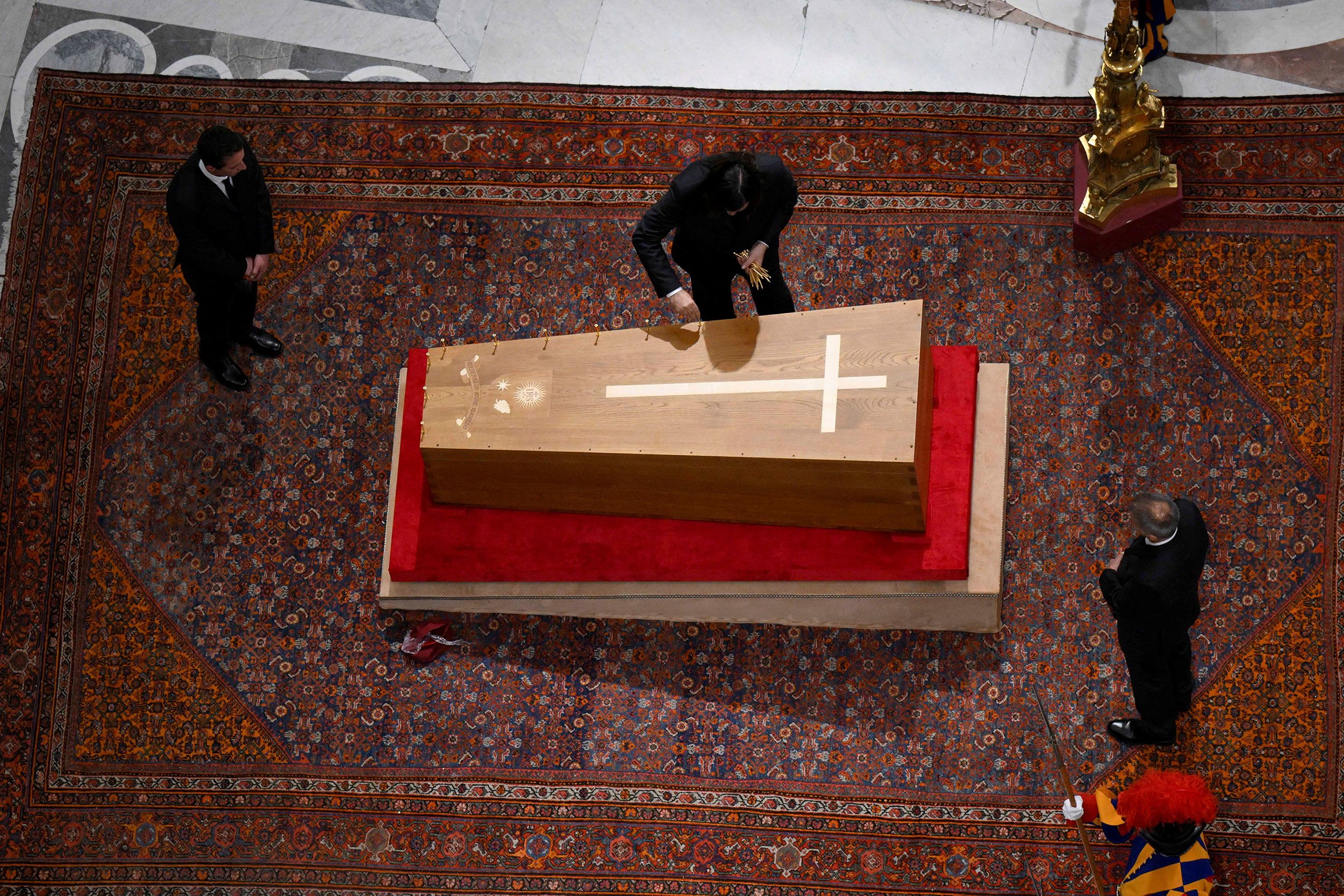 The pope's casket is sealed Friday, formally ending his lying in state.