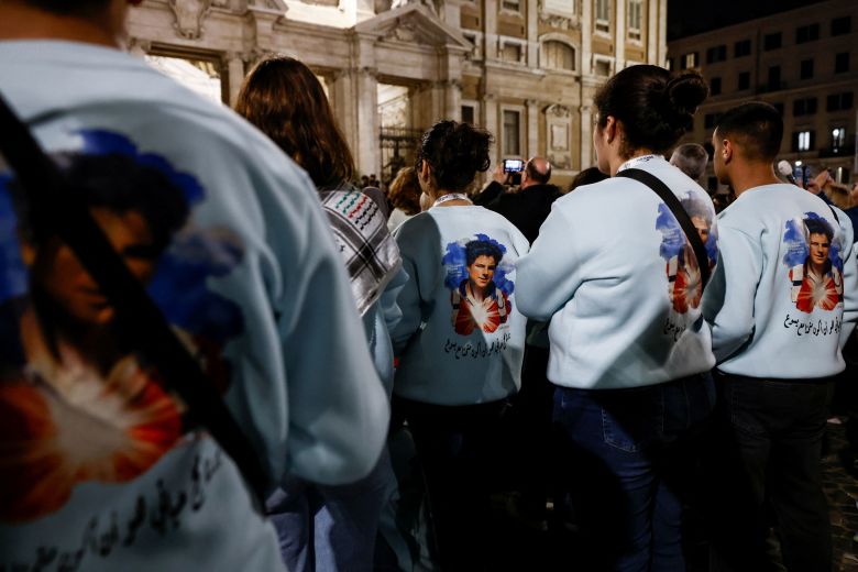 People wearing shirts with an image of Acutis attend a prayer service at the Papal Basilica of Santa Maria Maggiore in Rome on April 25.