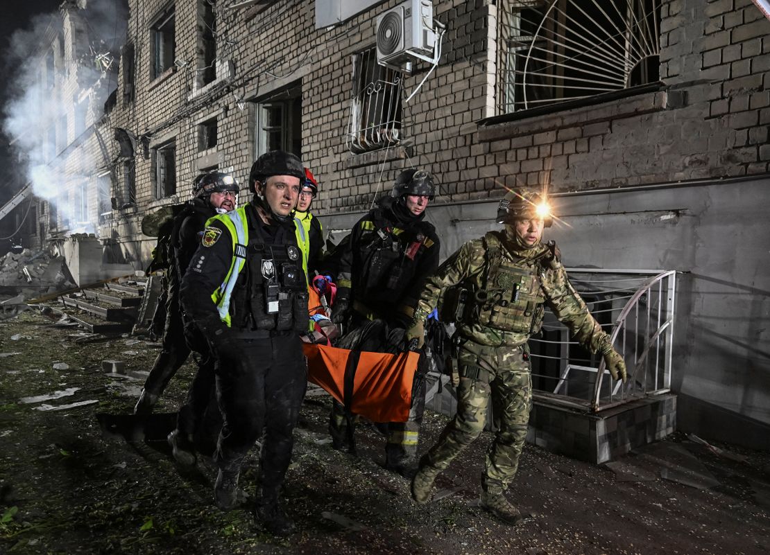 Rescuers evacuate a wounded resident from an apartment building damaged during a Russian drone strike in Zaporizhzhia, Ukraine on May 1, 2025.
