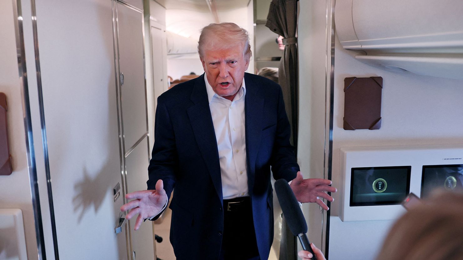 U.S. President Donald Trump speaks to members of the media as he flies back to Washington from West Palm Beach aboard Air Force One, U.S., May 4, 2025. REUTERS/Leah Millis
