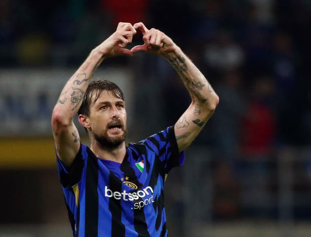 Inter Milan's Francesco Acerbi celebrates scoring his team's third goal.