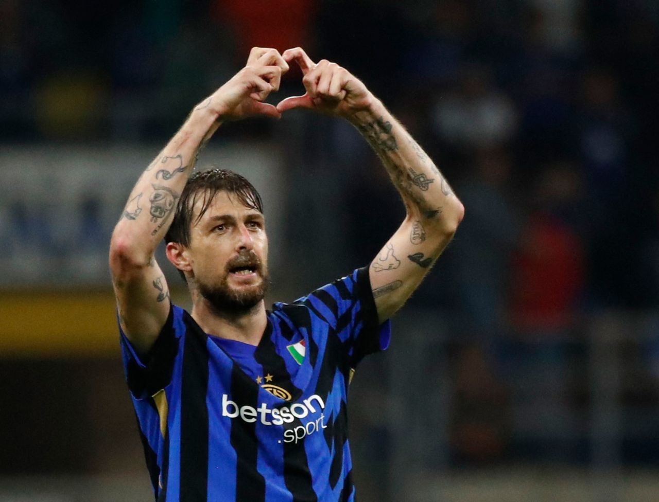 Inter Milan's Francesco Acerbi celebrates after scoring against Barcelona.