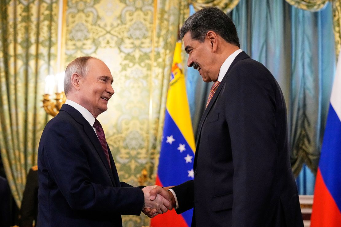 Russian President Vladimir Putin shakes hands with his Venezuelan counterpart Nicolas Maduro during a meeting at the Kremlin in Moscow on Wednesday.