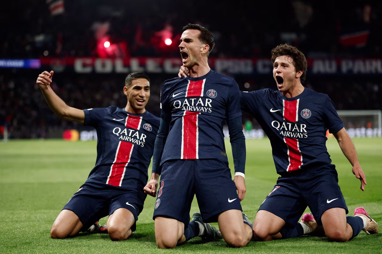 Paris Saint-Germain's Fabián Ruiz celebrates scoring their first goal with Achraf Hakimi and Joao Neves.