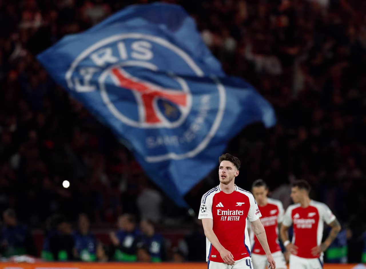 Arsenal's Declan Rice looks dejected after Paris Saint-Germain's Achraf Hakimi scores.
