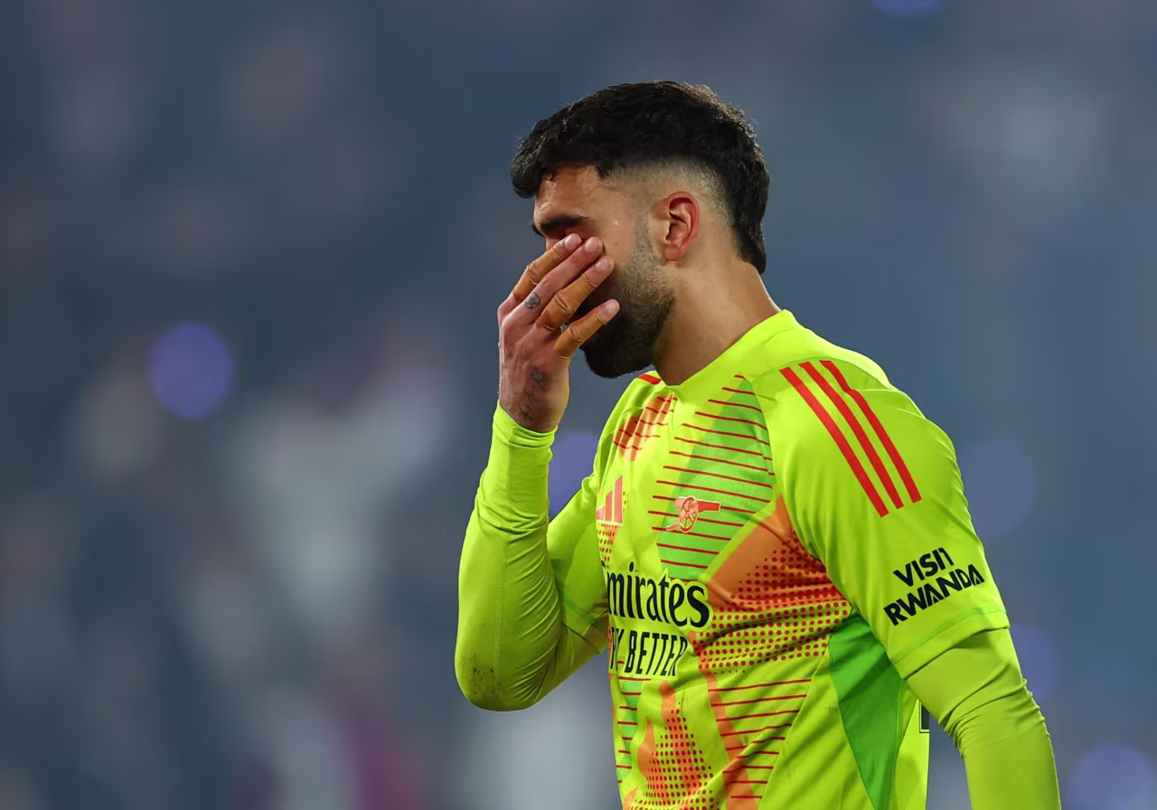 Arsenal's David Raya looks dejected after the match.