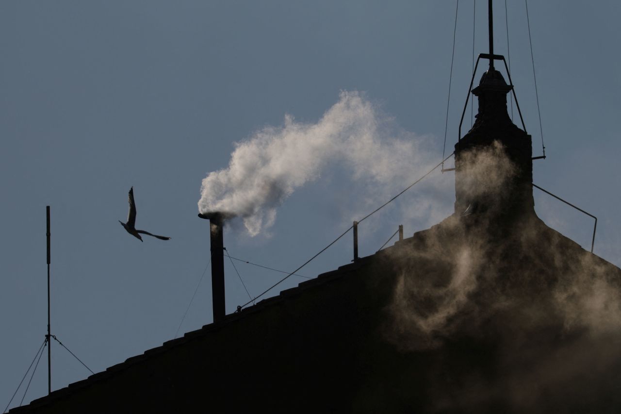 White smoke rises from the chimney on the Sistine Chapel on Thursday.