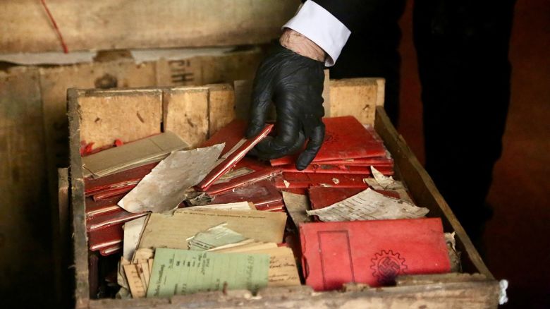A person holds Nazi-related material that was originally confiscated by local authorities when it was shipped to Argentina in 1941, after several boxes containing the material were recently discovered by chance in the archives of the Supreme Court of Argentina, in Buenos Aires, Argentina in this handout picture released on May 11, 2025. Corte Suprema de Justicia de la Republica Argentina/Handout via REUTERS ATTENTION EDITORS - THIS IMAGE HAS BEEN SUPPLIED BY A THIRD PARTY. NO RESALES. NO ARCHIVES