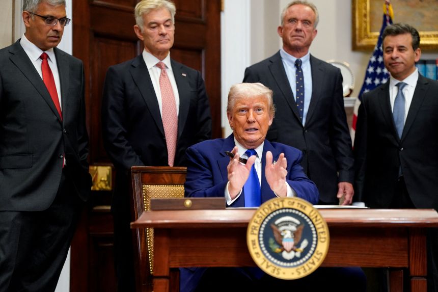 President Donald Trump signs an executive order on prescription drug pricing in May.