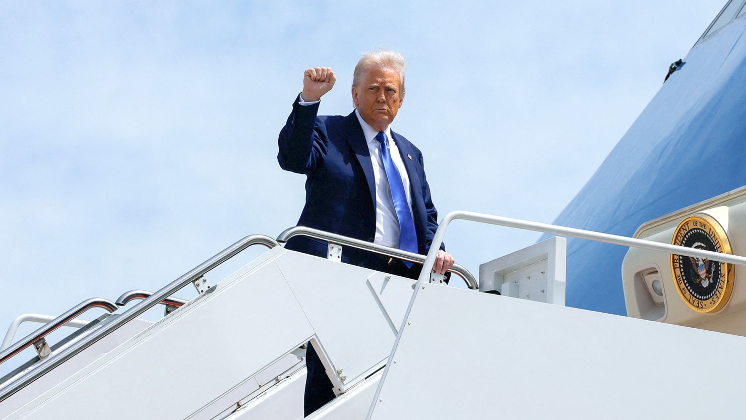 US President Donald Trump gestures as he boards Air Force One, departing for Saudi Arabia, Qatar and the United Arab Emirates, at Joint Base Andrews, in Maryland, US on Monday.