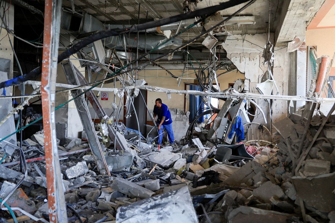 A person inspects Nasser Hospital on Tuesday, a part of which was damaged in the aftermath of an Israeli strike, according to hospital officials.
