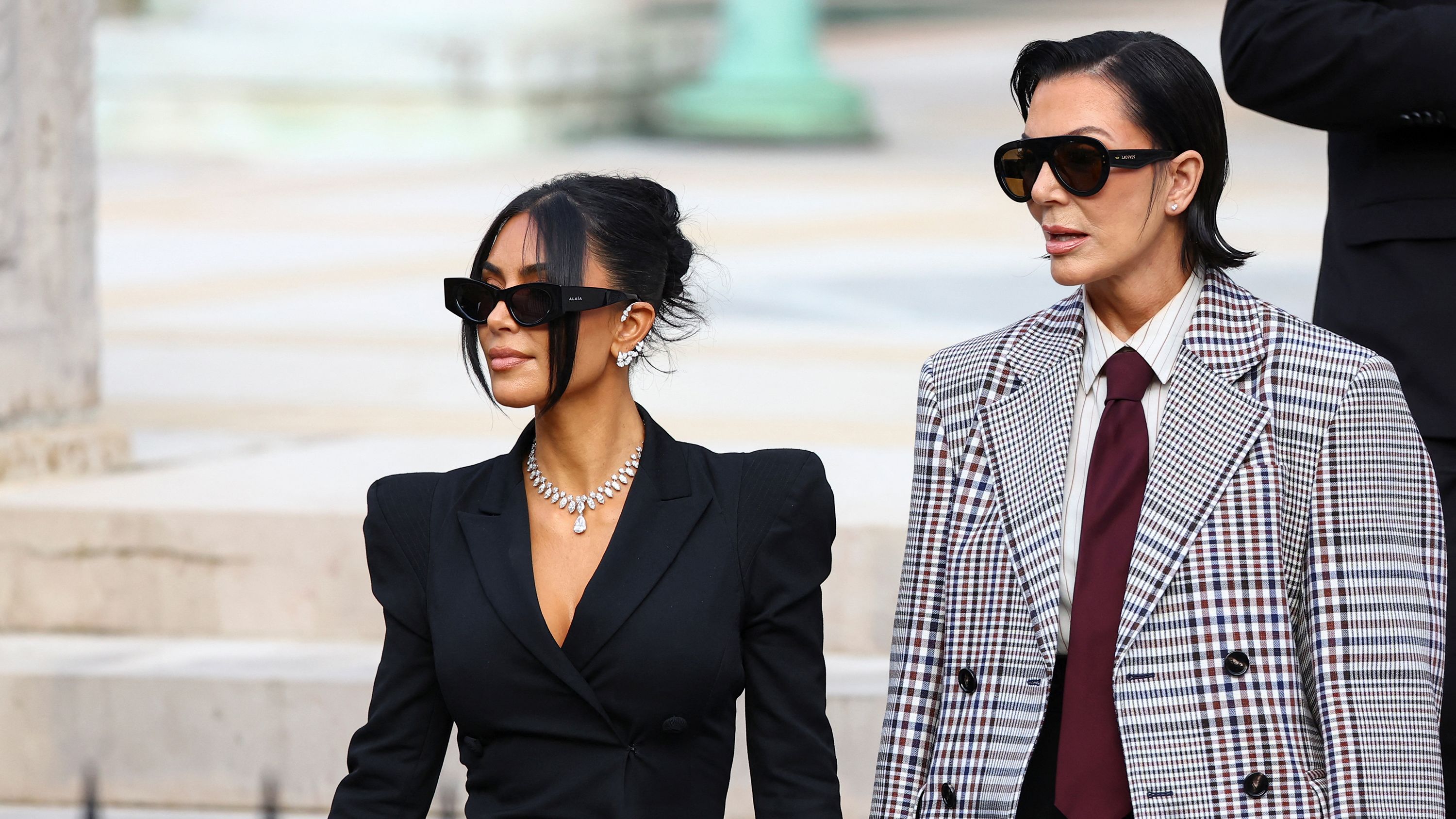 Kim Kardashian, accompanied by Kris Jenner, leaves the courthouse of the trial of 10 people accused of stealing millions of dollars worth of jewellery from her, in Paris, France, on May 13, 2025.