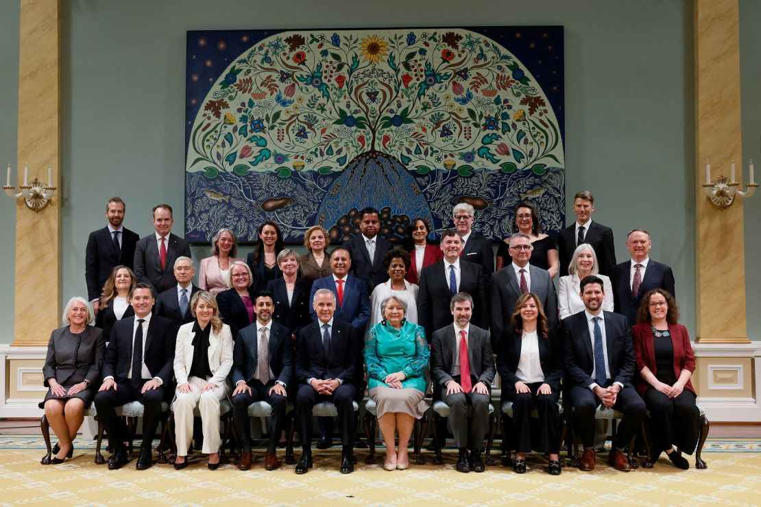 Canadian Prime Minister Mark Carney and Governor General Mary Simon pose for a group photo with newly sworn-in cabinet members at Rideau Hall in Ottawa on Tuesday.