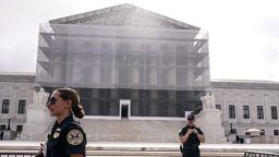 Police officers stand guard outside the US Supreme Court in Washington, DC, on May 15, 2025.