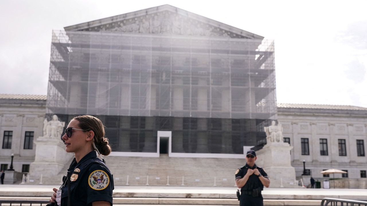 Police officers stand guard outside the US Supreme Court in Washington, DC, on May 15, 2025.