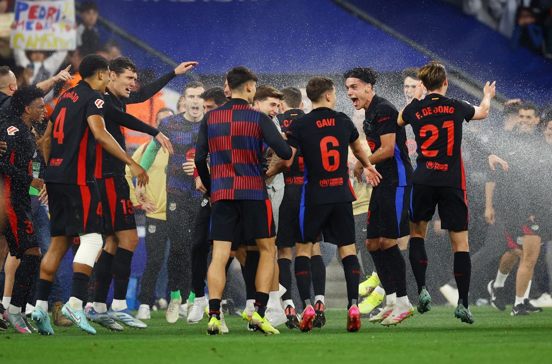 Barcelona players celebrate winning the La Liga title after Thursday's victory.