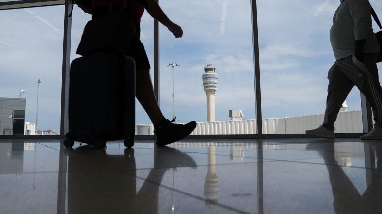 People walk at the Hartsfield-Jackson Atlanta International Airport terminal in Atlanta, Georgia, on May 15, 2025.