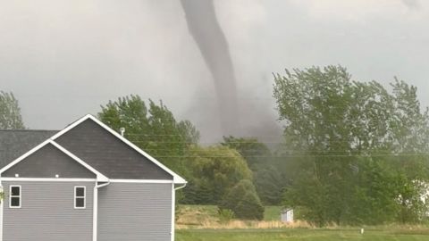 A tornado swirls in New Richmond, Wisconsin, on Thursday, in this screengrab obtained from a social media video.