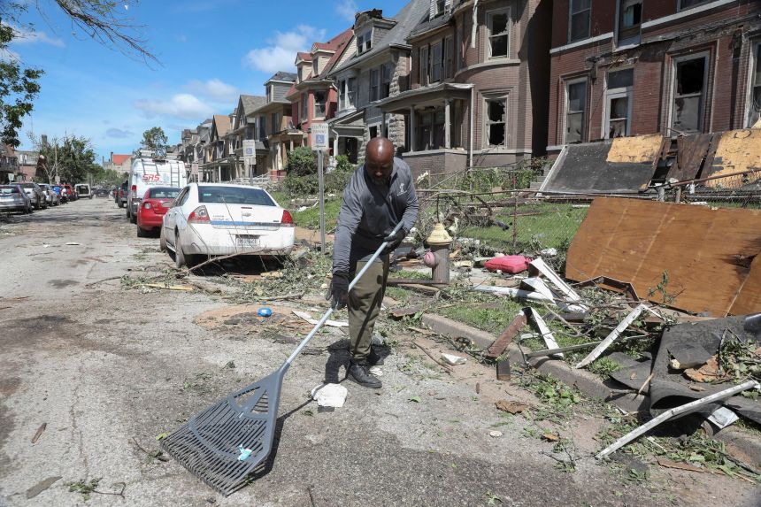 A man helps remove the debris after a tornado struck in St. Louis, Missouri, U.S., May 17, 2025. REUTERS/Lawrence Bryant 