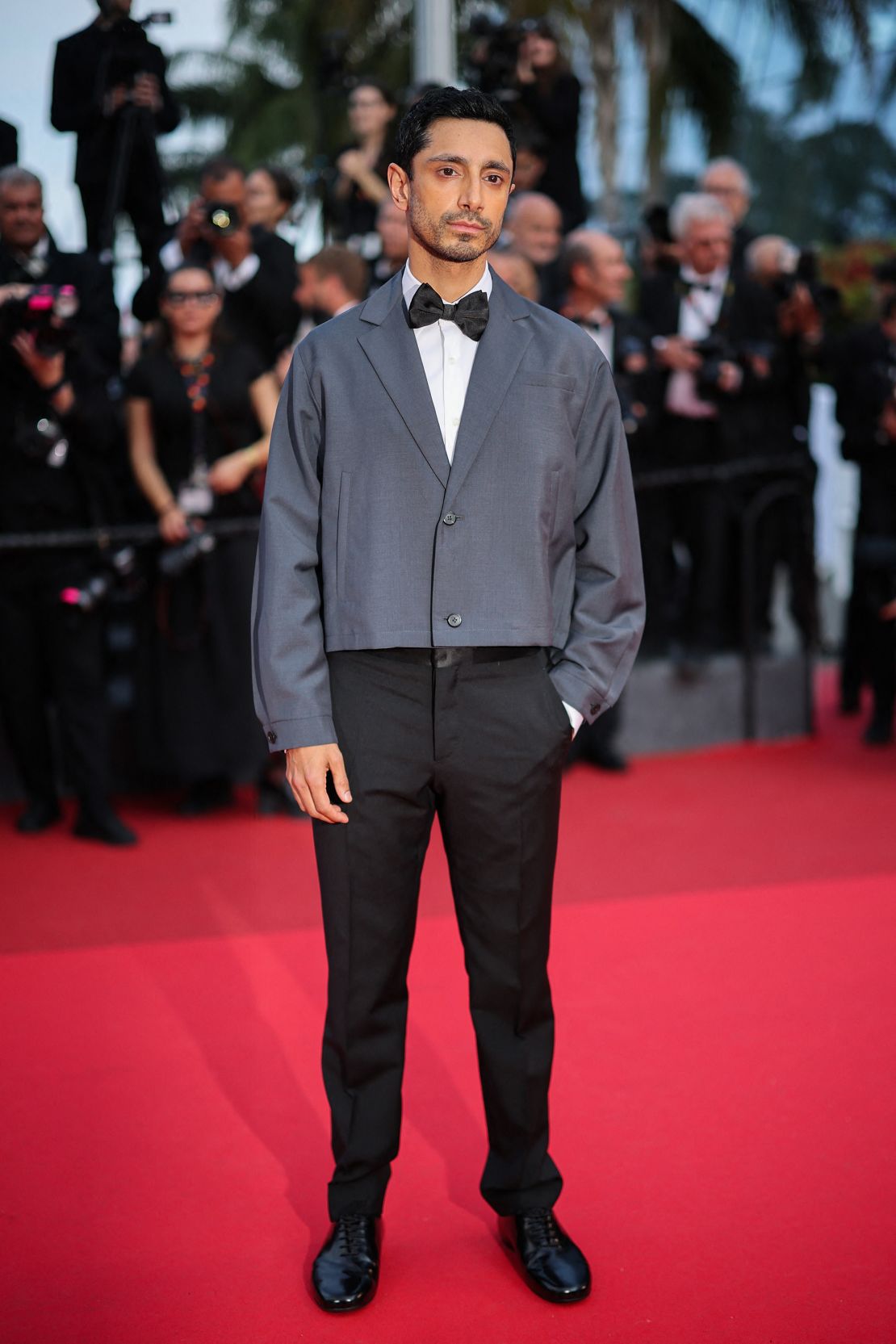 Riz Ahmed arrived to the 'The Phoenician Scheme' red carpet on 18 May in a Prada suit.
