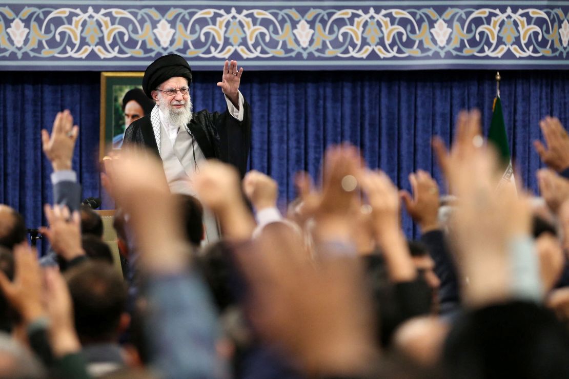 Iran's Supreme Leader Ayatollah Ali Khamenei waves during a meeting in Tehran, Iran on Tuesday.