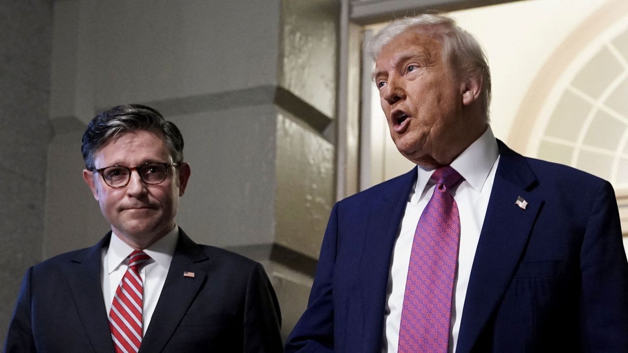 U.S. President Donald Trump and U.S. House Speaker Mike Johnson (R-LA) speak to members of the media, on the day of a closed House Republican Conference meeting on Capitol Hill in Washington, D.C., U.S., May 20, 2025. REUTERS/Ken Cedeno
