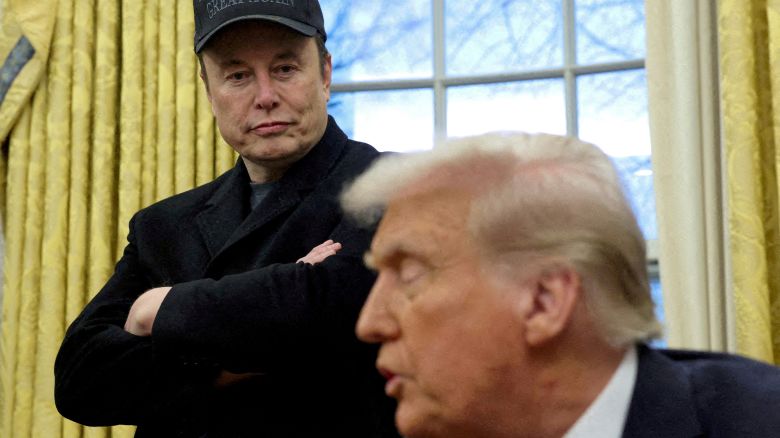Elon Musk listens to President Donald Trump speak in the Oval Office of the White House in Washington, DC, on February 11.