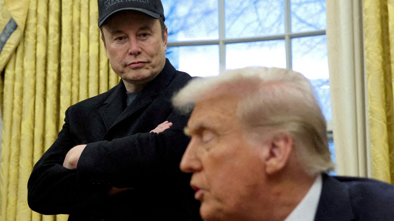 Elon Musk listens to President Donald Trump speak in the Oval Office of the White House in Washington, DC, on February 11.