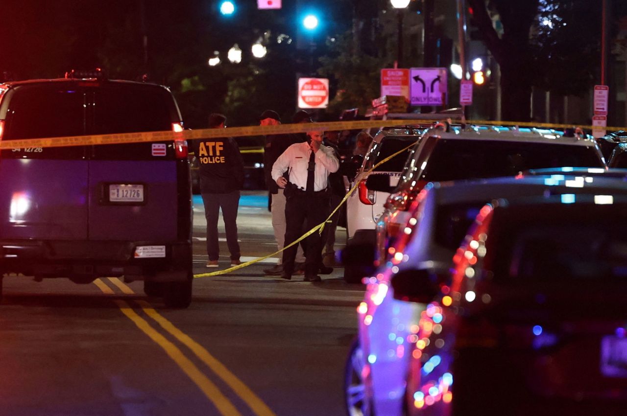 Police officers work at the site of the shooting in Washington, DC on Wednesday night.
