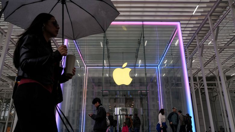 People walk past the Apple Fifth Avenue store in New York City.