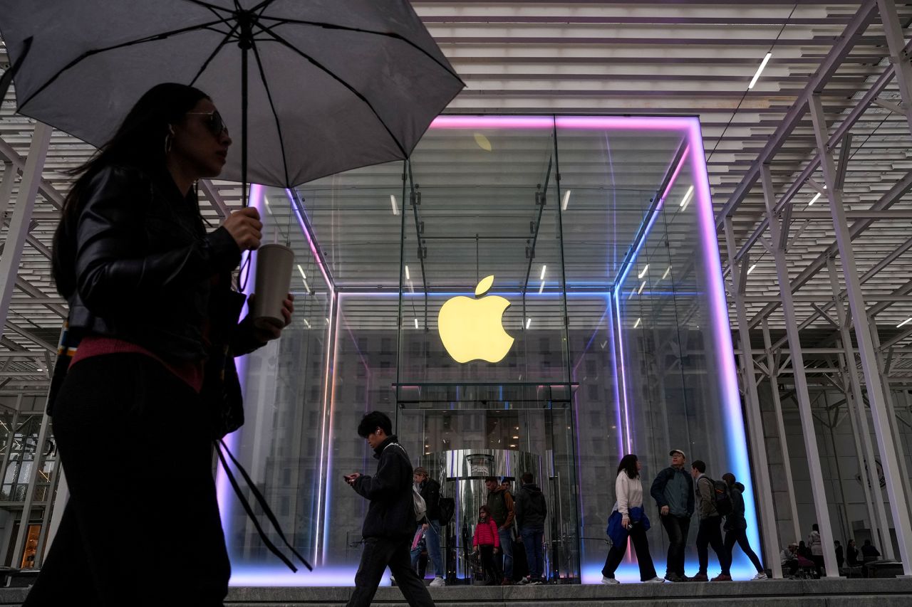People walk past the Apple Fifth Avenue store in New York City, on May 23, 2025.