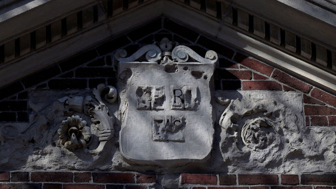 The Harvard University shield "VERITAS" sits above a campus entrance gate at Harvard University in Cambridge, Massachusetts, U.S., April 15, 2025.