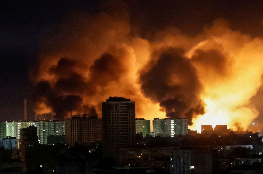 An explosion lights up the sky over Kyiv.
