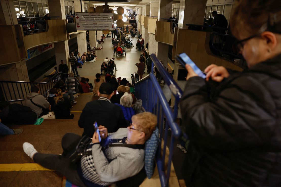 People take shelter inside a metro station in Kyiv on Sunday.