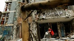 A municipality worker cleans an apartment building that was damaged in a Russian drone strike, amid Russia's attack on Ukraine, in Kyiv, Ukraine, on May 25, 2025.