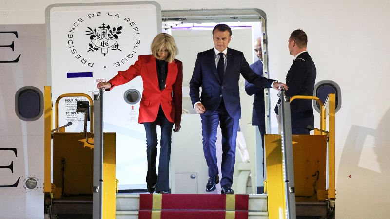 Macron’s office dismisses viral video showing apparent shove from wife Brigitte | CNN