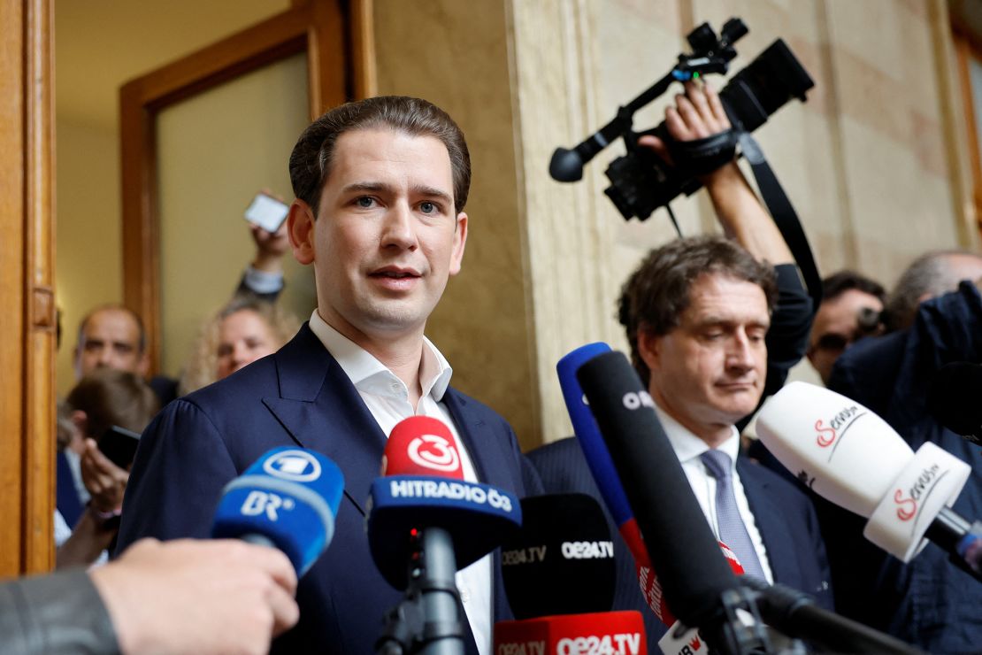 Kurz speaks to the media after winning an appeal against his perjury conviction.