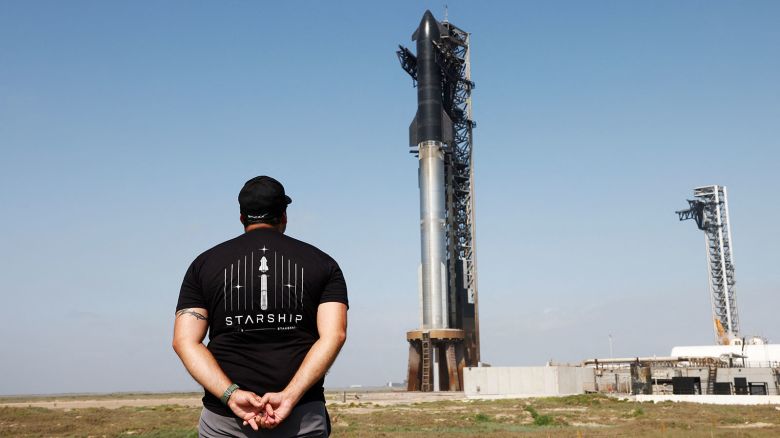 Matt Farrah of Newcastle, Australia views SpaceX's next-generation Starship spacecraft atop its Super Heavy booster is prepared for launch on its ninth test at the company's launch pad in Starbase, Texas, U.S., May 27, 2025. REUTERS/Joe Skipper