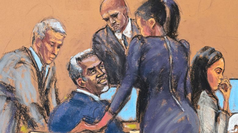 Sean "Diddy" Combs speaks with his legal team before court begins for the day at Combs' sex trafficking trial in New York City, New York, U.S., May 27, 2025 in this courtroom sketch. REUTERS/Jane Rosenberg
