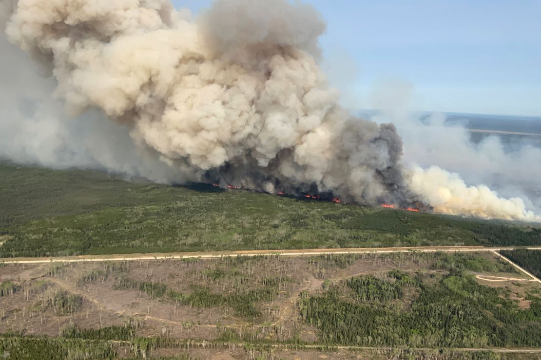 Smoke rises from wildfire WE023 near Wanless, Manitoba, Canada.