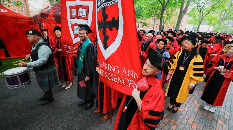 Students walk to attend the 374th Commencement exercises at Harvard University in Cambridge, Massachusetts, U.S., May 29, 2025.  REUTERS/Brian Snyder