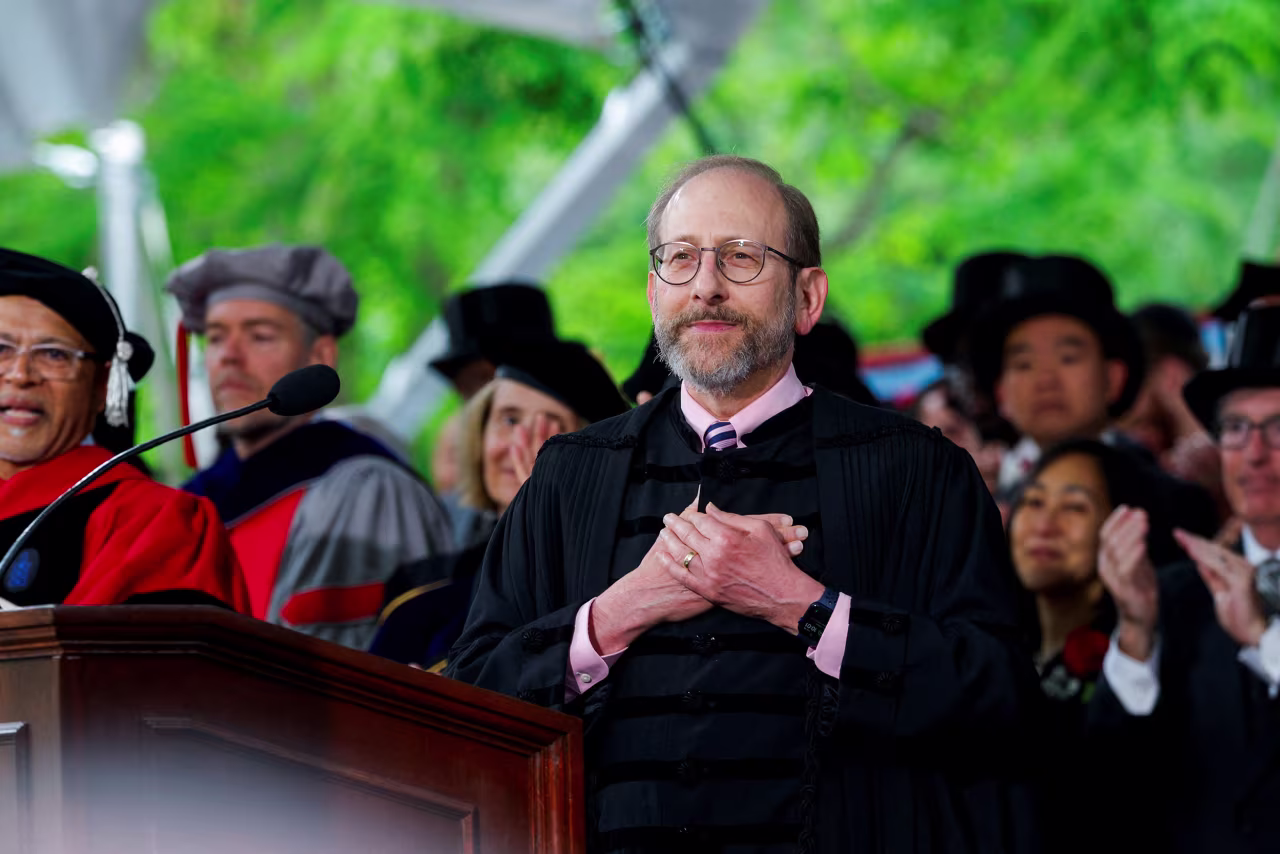 Harvard University President Alan Garber reacts to a standing ovation during the Harvard commencement in Cambridge, Massachusetts, on Thursday.