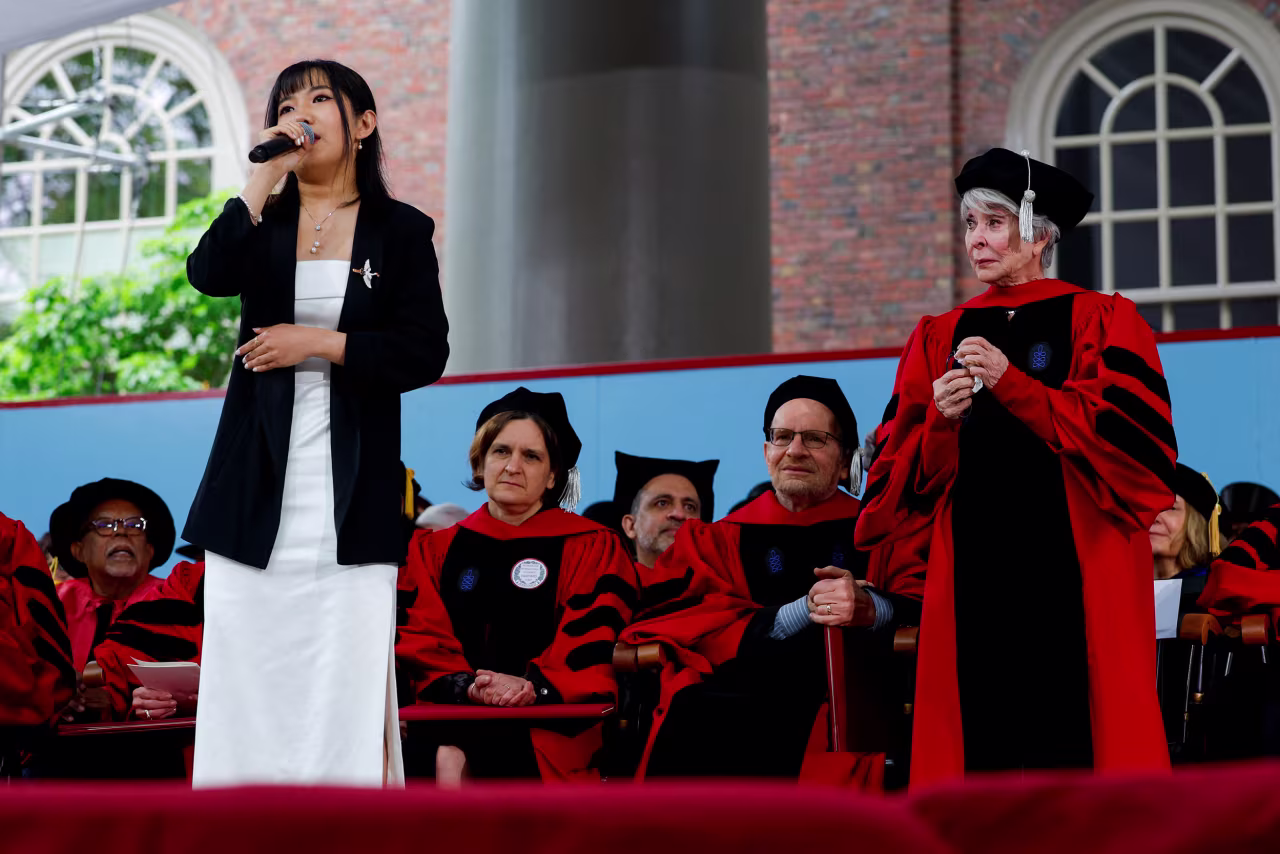 Rita Moreno looks on as Carolyn Hao performs during the Harvard University commencement ceremony on Thursday.