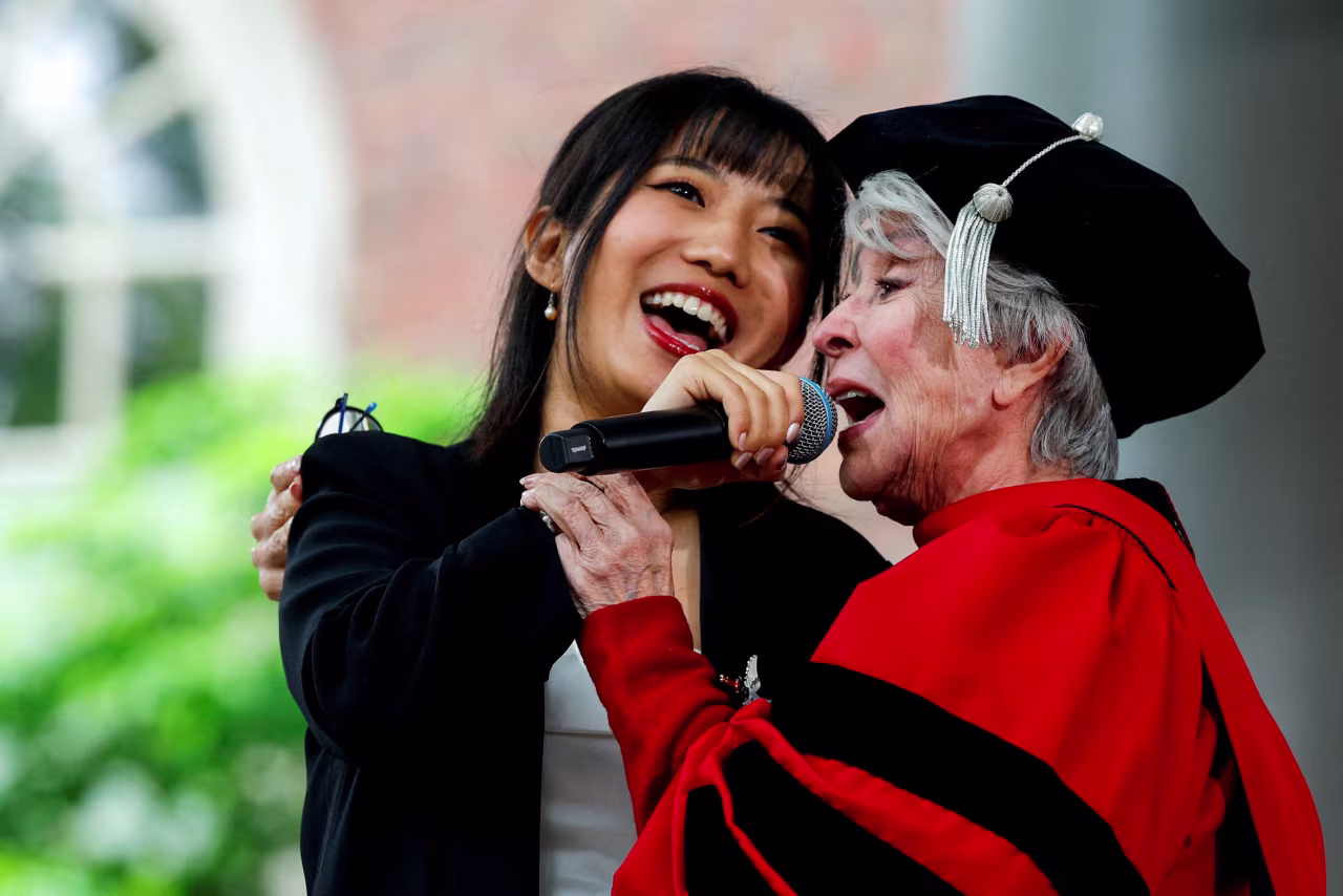 Carolyn Hao and Rita Moreno perform during the commencement ceremony.