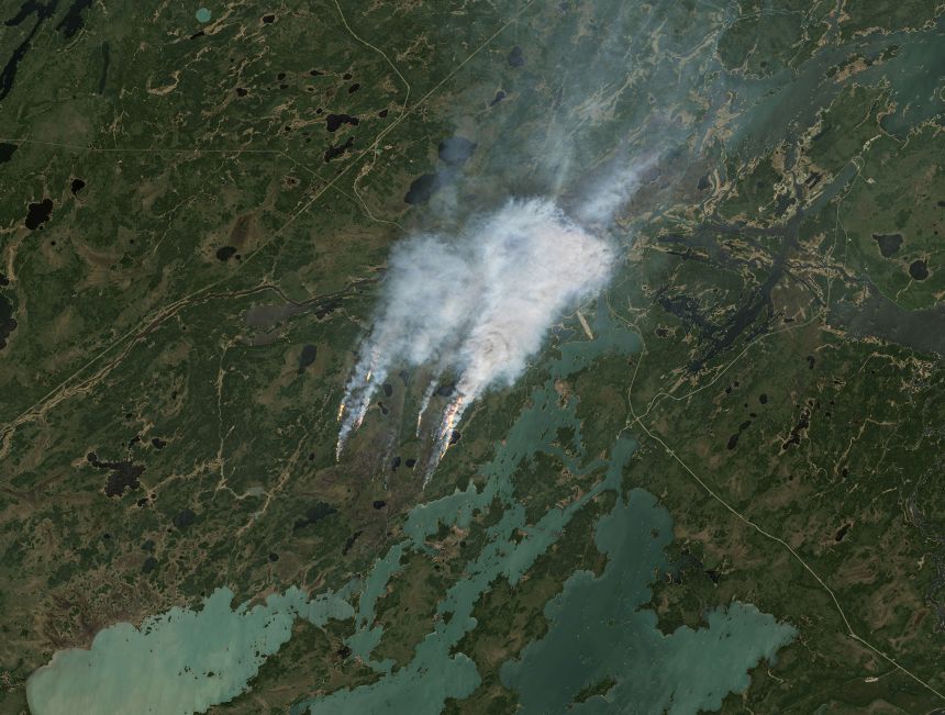 A satellite image shows smoke rising from wildfires in Manitoba, Canada, on May 27, 2025.