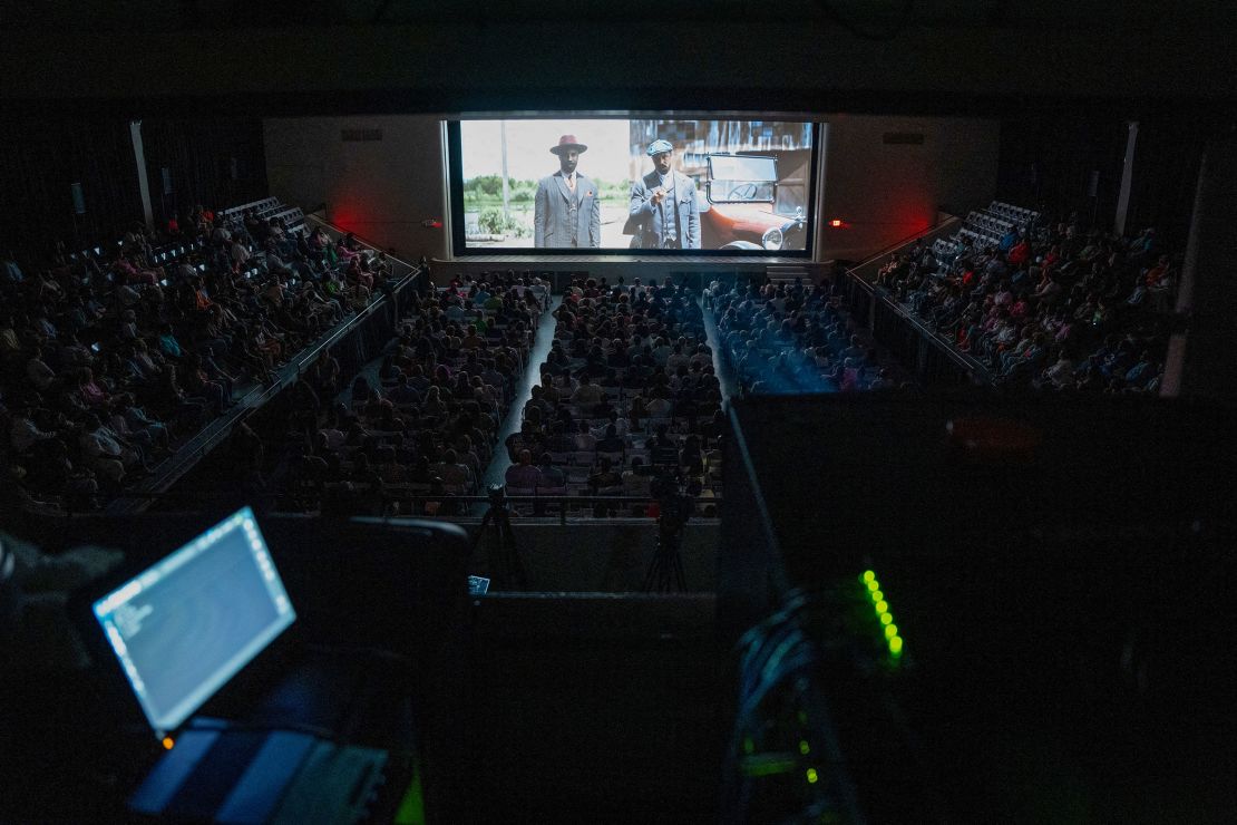Attendees watch a special screening of the film 