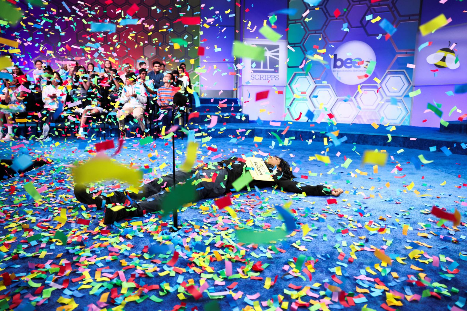 Faizan Zaki, a 13-year-old from Allen, Texas, reacts after <a href="index.php?page=&url=https%3A%2F%2Fwww.cnn.com%2F2025%2F05%2F29%2Fus%2Fspelling-bee-faizan-zaki">winning the annual Scripps National Spelling Bee</a> in Oxon Hill, Maryland, on Thursday, May 29. After correctly spelling his final word, “eclaircissement,” he pumped his fists and collapsed to the stage.
