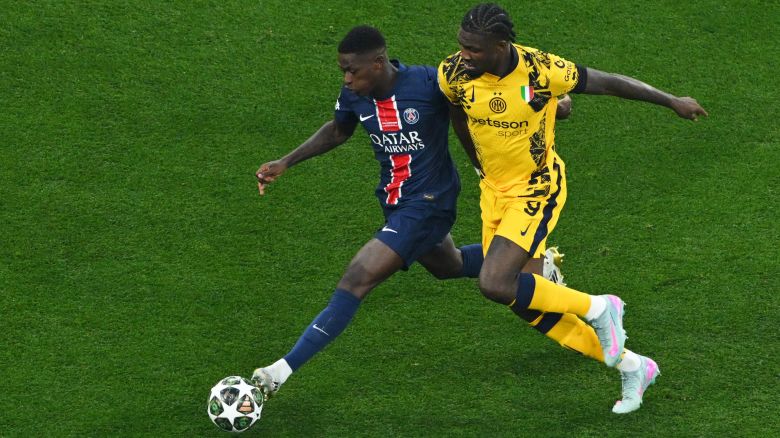 Soccer Football - Champions League - Final - Paris St Germain v Inter Milan - Allianz Arena, Munich, Germany - May 31, 2025 Paris St Germain's Nuno Mendes in action with Inter Milan's Marcus Thuram REUTERS/Annegret Hilse