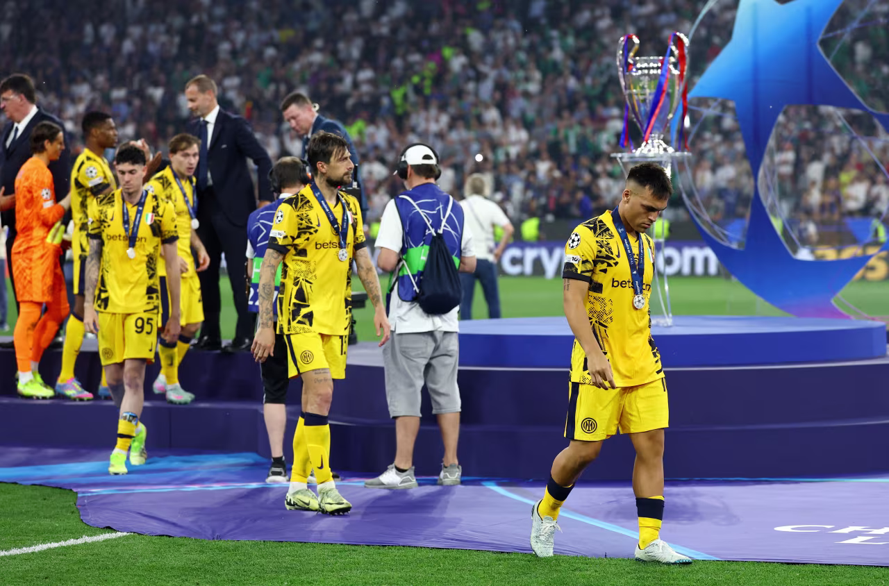 Inter players receive their runner-up medals.