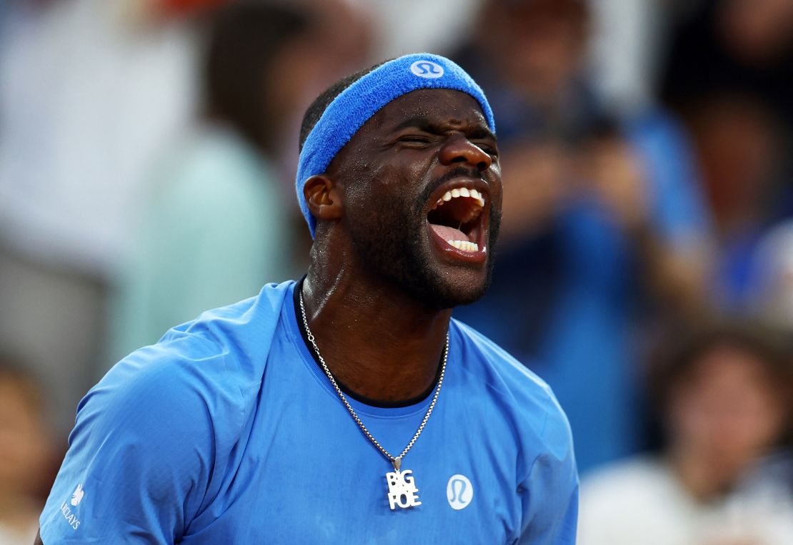 American Frances Tiafoe celebrates after winning his fourth round match against Germany's Daniel Altmaier at the French Open on Sunday.